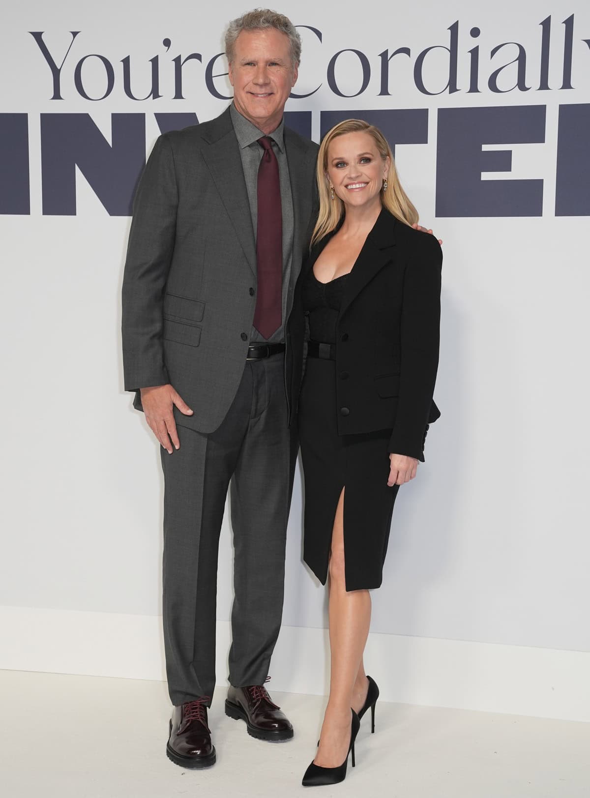 Despite her sleek Christian Louboutin Hot Chick slingback heels, Reese Witherspoon highlights her petite stature next to the towering Will Ferrell at the UK Special Screening of You're Cordially Invited on January 23, 2025, in London, England