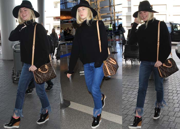 Puloverul negru cu blugi cu tivul franjurat al lui Elle Fanning