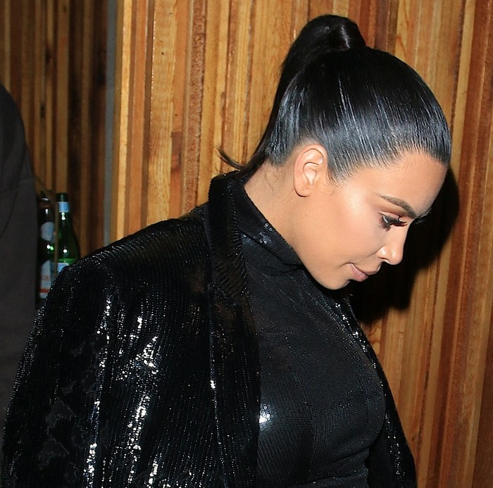 Kim Kardashian wears her hair back into a high ponytail