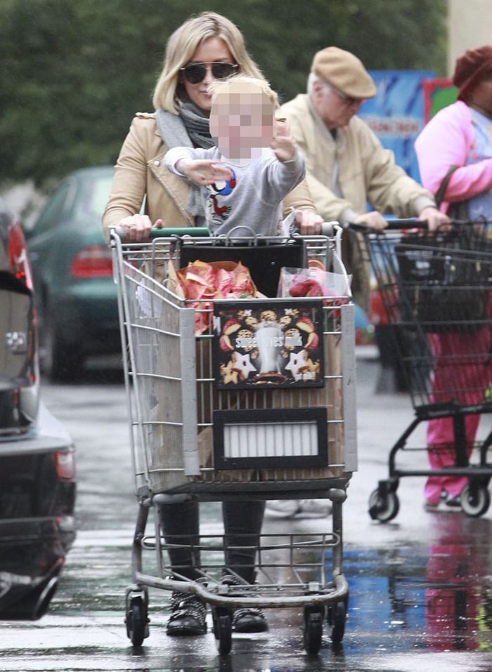 Hilary Duff pushes her son Luca in a shopping cart