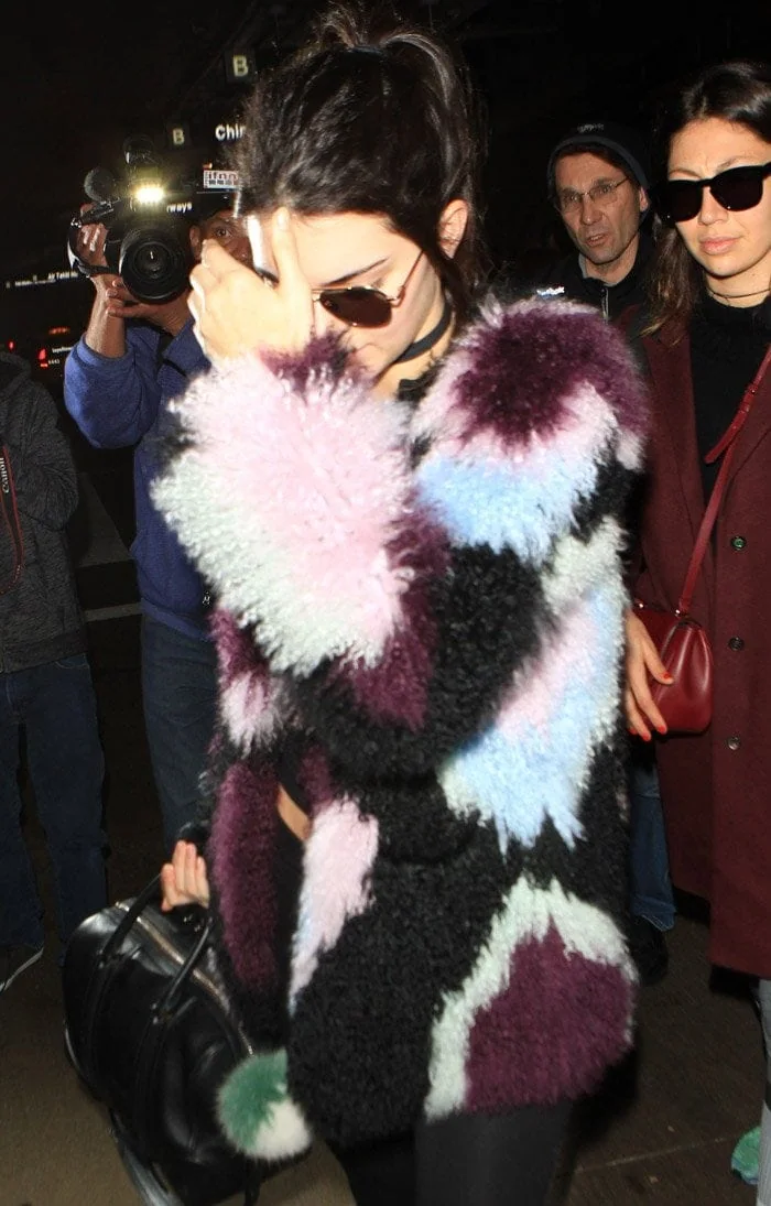 Kendall Jenner in an Elizabeth and James Bee jacket arrives at Los Angeles International Airport in California on December 8, 2015