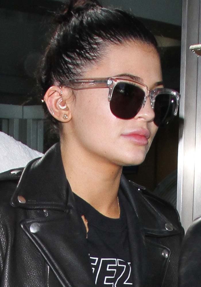 Kylie Jenner wears her hair up as she arrives at Los Angeles International Airport