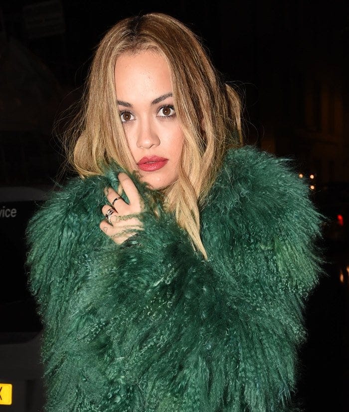 Rita Ora in a green fur coat leaves One Mayfair after attending a charity event in London on December 15, 2015