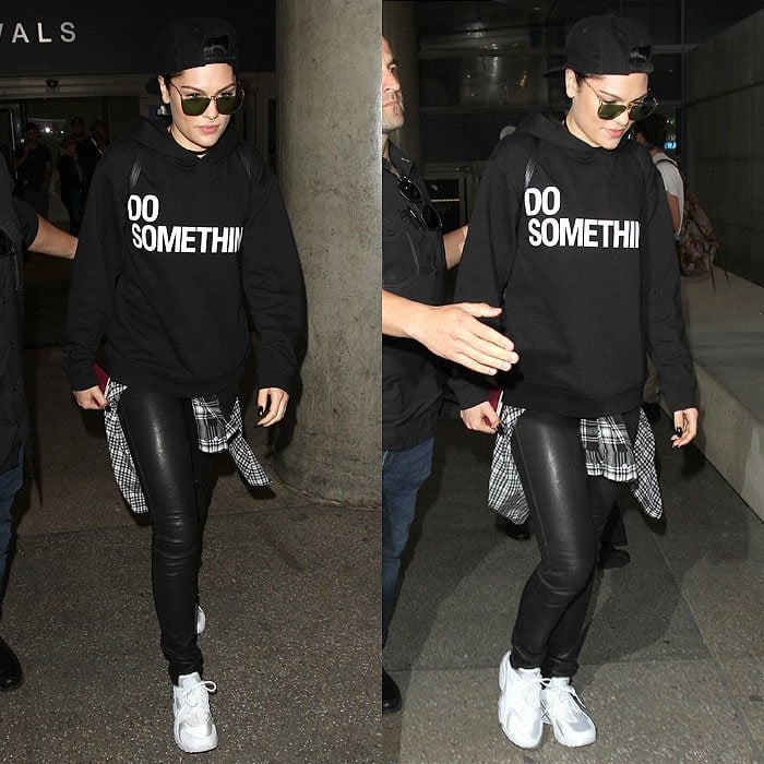 Jessie J wears white sneakers with a statement-printed sweater