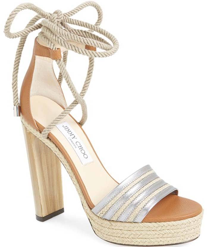 A scene-stealing sandal boasts tons of summer-chic style with its braided jute platform and ropey wrapround ankle ties, while a sky-high marbled heel gives an alluring, eye-catching lift