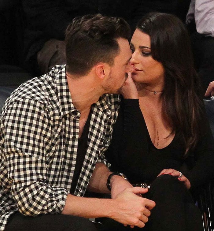 Matthew Paetz leans in to give his girlfriend Lea Michele a kiss while watching the Los Angeles Lakers play The Golden State Warriors