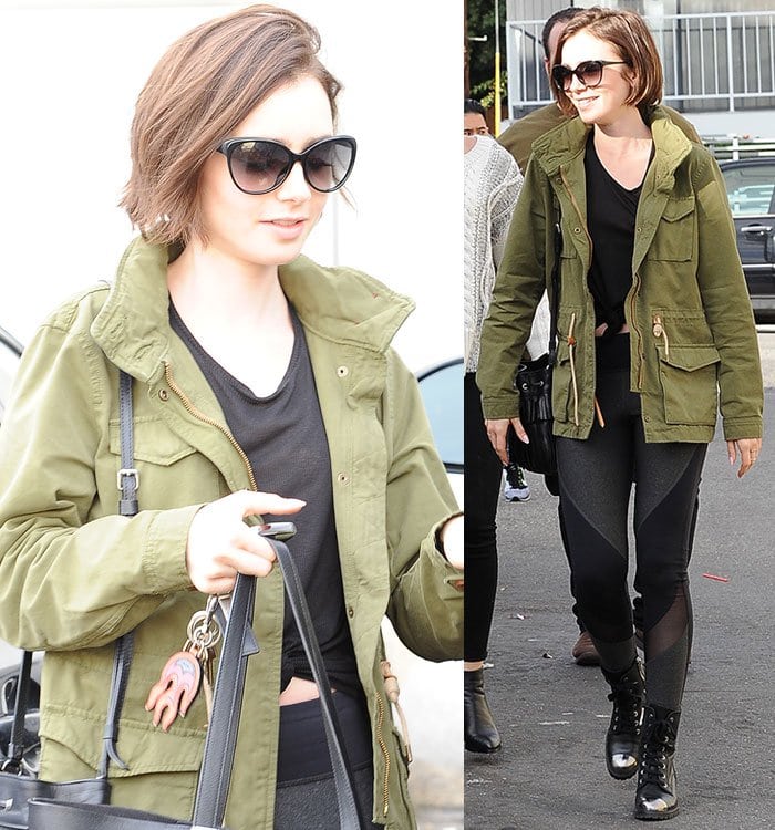 Lily Collins wears an olive green Levi's jacket and a pair of black leggings