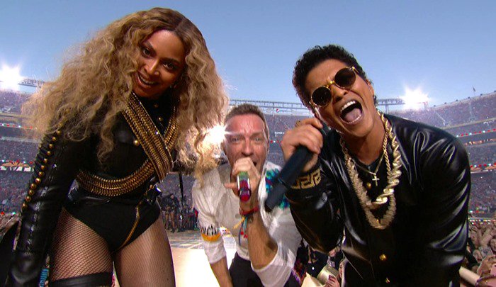 Beyoncé and Bruno Mars, both in black and gold outfits, bring powerful energy to the Super Bowl 50 Halftime Show alongside Coldplay's Chris Martin