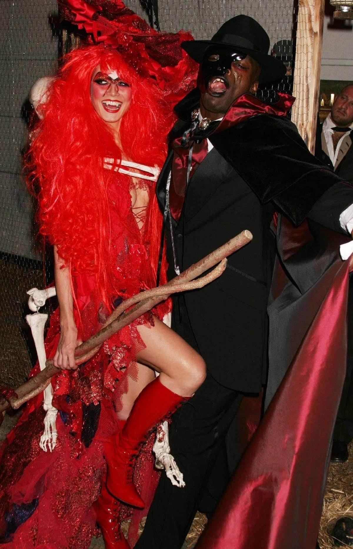 Heidi Klum as a red witch and Seal as the Phantom from The Phantom of the Opera attend her 5th Annual Halloween party
