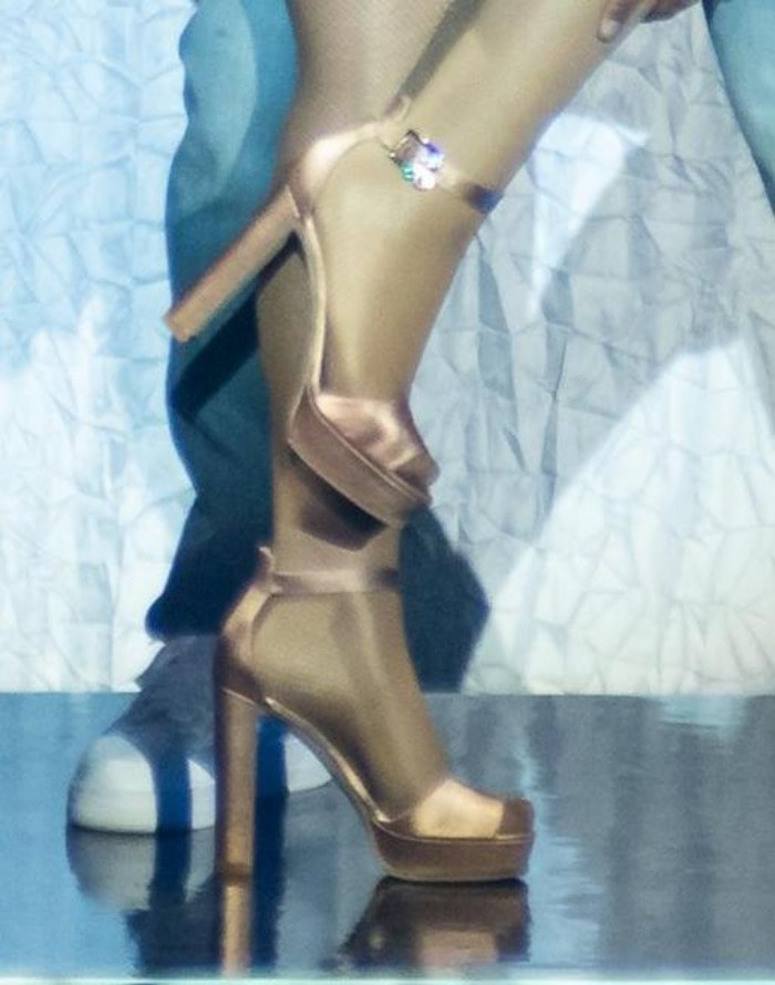 Mariah Carey in glamorous rose gold platform sandals with a chunky heel and buckled ankle straps during her 'Sweet Sweet Fantasy' tour