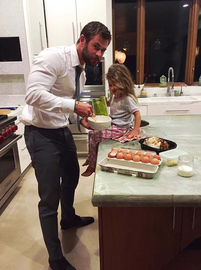 Elsa Pataky uploads an adorable photo of her husband with their daughter, captioned, "Papa making some late snack after premiere @thehunstman #jetlag #bestglamour #yummy #papachef #bestmoments #latrip"