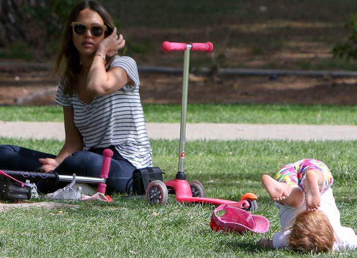 Jessica Alba watches on as her younger daughter, Haven, plays at the park