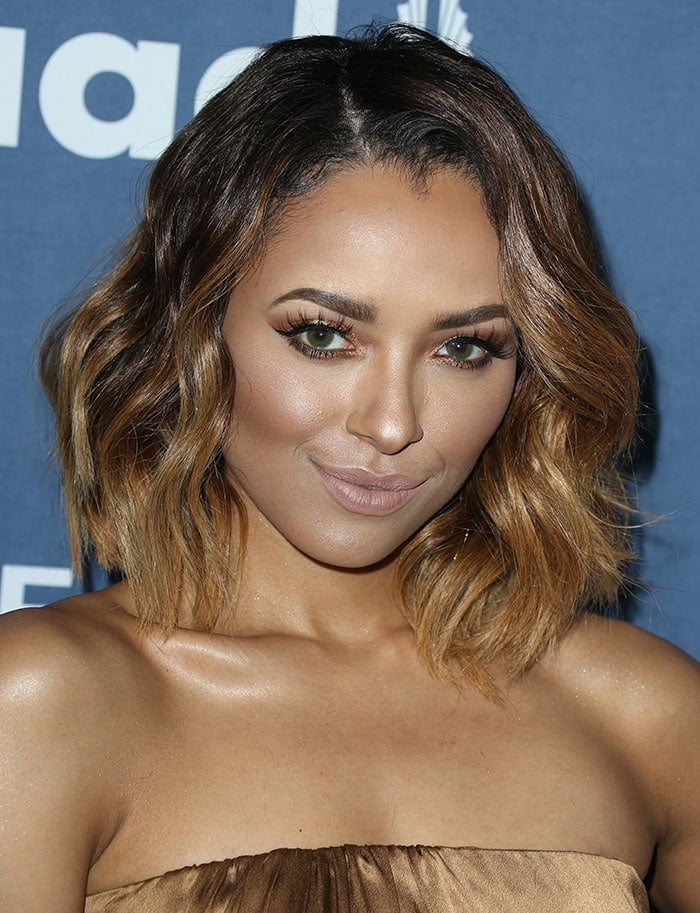 Kat Graham shows off her hair's highlights at the 27th annual GLAAD Media Awards