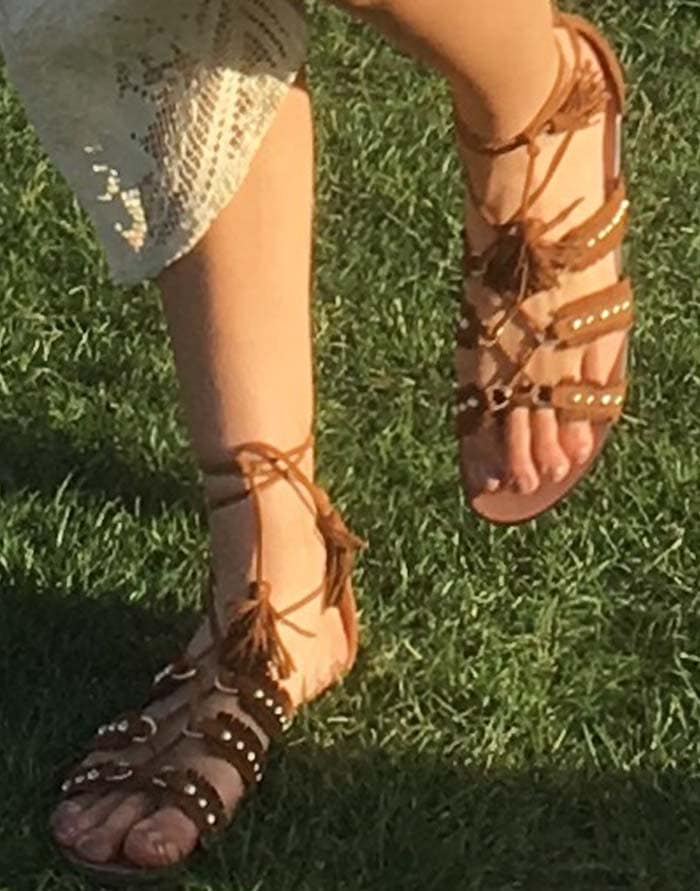 Kendall Jenner's feet in a pair of fringed and studded Aquazzura sandals