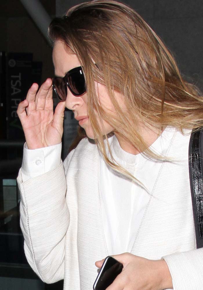 Mary-Kate Olsen arrives at Los Angeles International Airport with unwashed hair