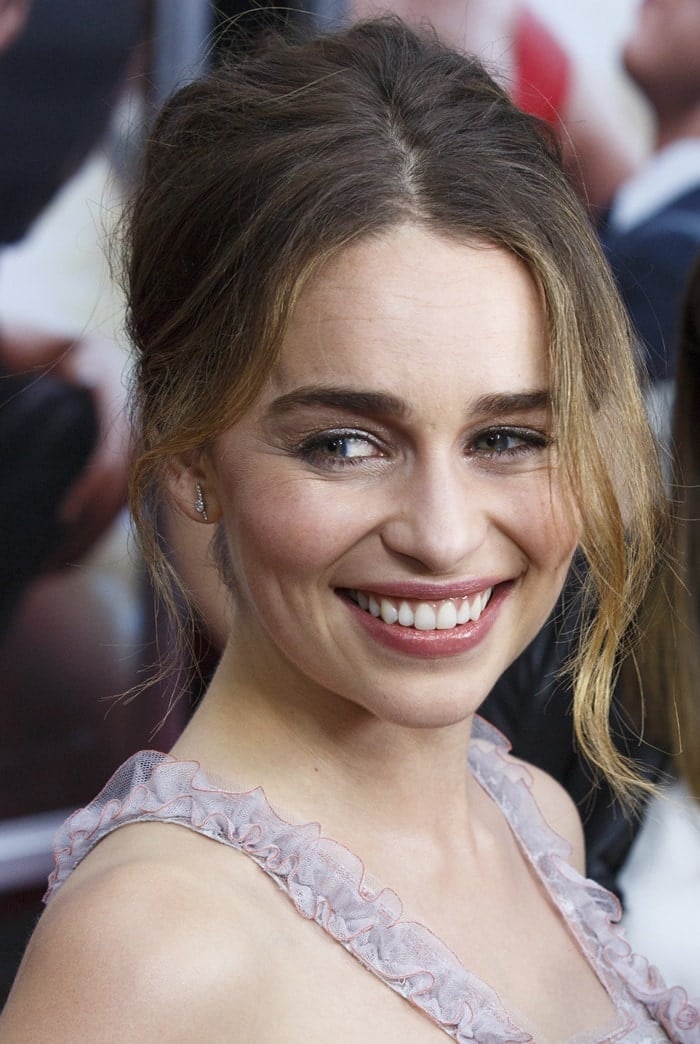 Emilia Clarke styles her hair into an updo for the world premiere of "Me Before You"