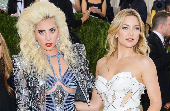 Lady Gaga and Kate Hudson pose for photos together on the red carpet of the Met Gala