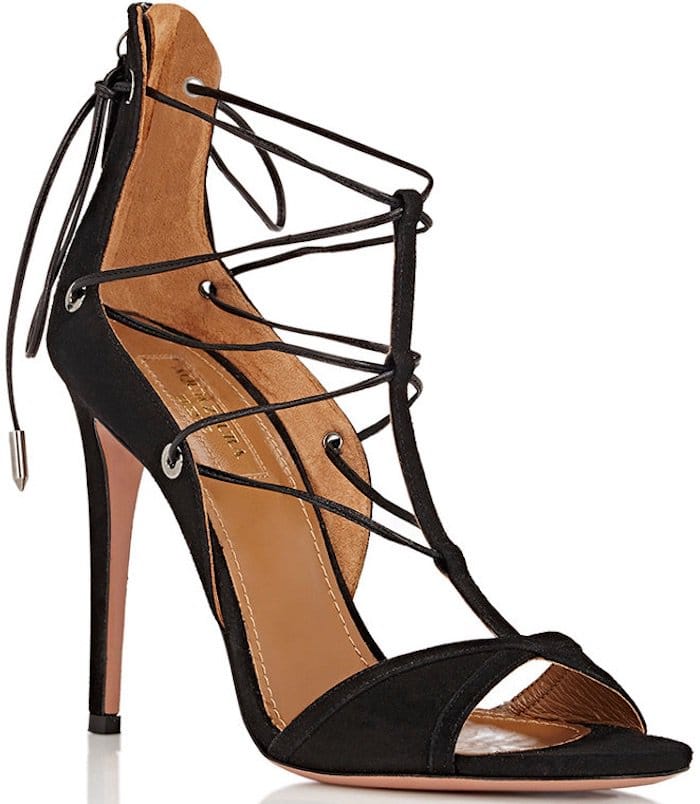 Black suede Aquazzura Cayenne 105 T-strap sandals with covered heels, lace-up closures at uppers, and zip closures at counters