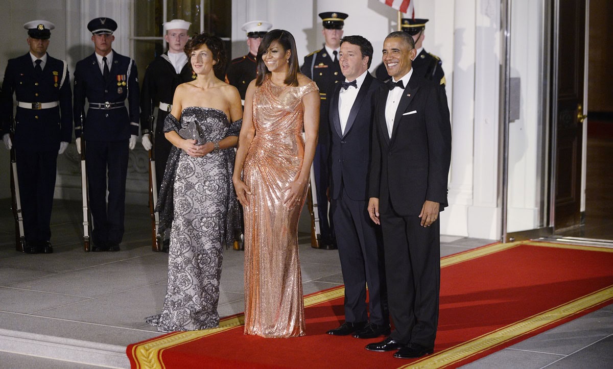 Michelle Obama dazzles in a rose gold Atelier Versace gown as she and President Barack Obama welcome Italian Prime Minister Matteo Renzi and Agnese Landini to the White House for a State Dinner