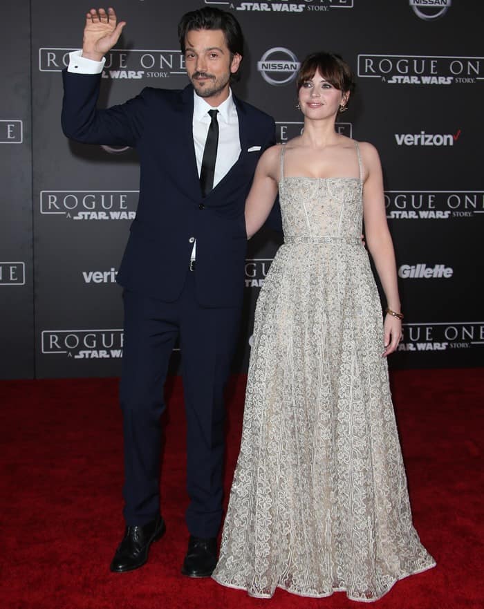 Felicity Jones dazzled in a lace Christian Dior gown while Diego Luna looked sharp in a navy suit as they waved to fans at the Rogue One: A Star Wars Story premiere