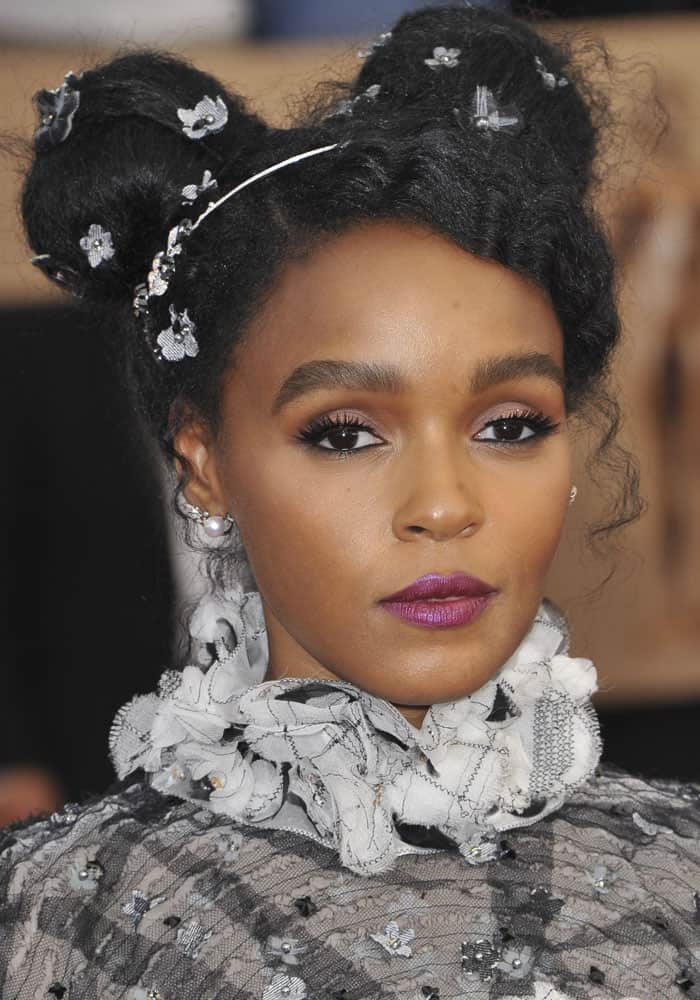 Janelle Monáe's signature floral embellished updo: a whimsical blend of style and sparkle at the 2017 SAG Awards