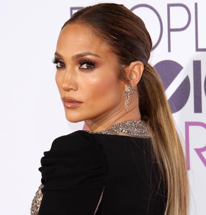 Jennifer Lopez completed her look with sparkling statement earrings that added a touch of glamour