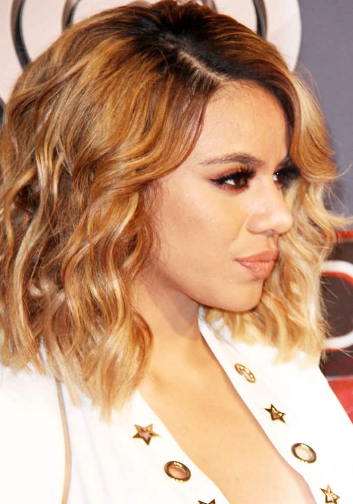 Dinah stands out in a white ensemble