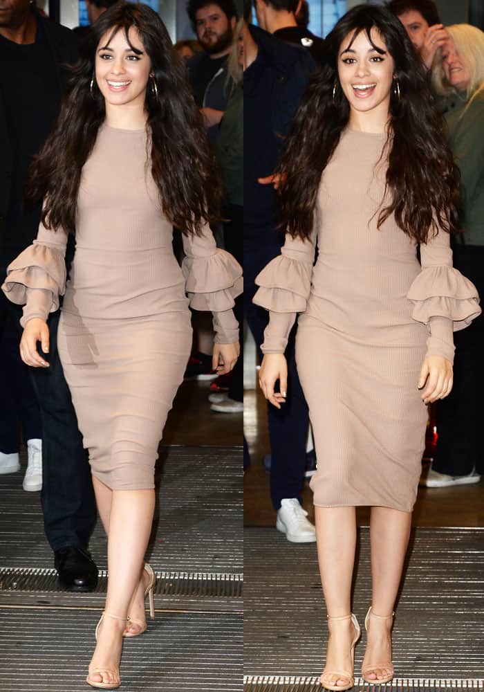 Camila Cabello looked sophisticated while flashing her legs in a nude-toned dress with ruffled sleeves