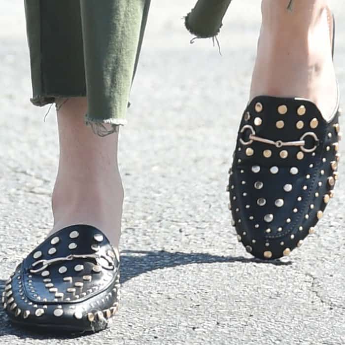 Bella stylishly finished her outfit with a pair of Gucci "Princetown" studded mules