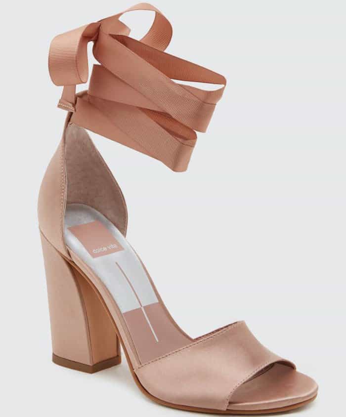 A grosgrain ribbon ankle strap provides a perfectly poised finish for this stunning satin sandal