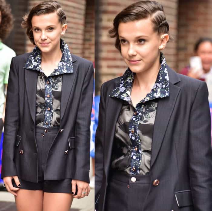 A closer look at Millie's outfit reveals the detailed styling of her CG suit, accented by a collared floral button-down shirt, showcasing her flair for combining classic and contemporary fashion