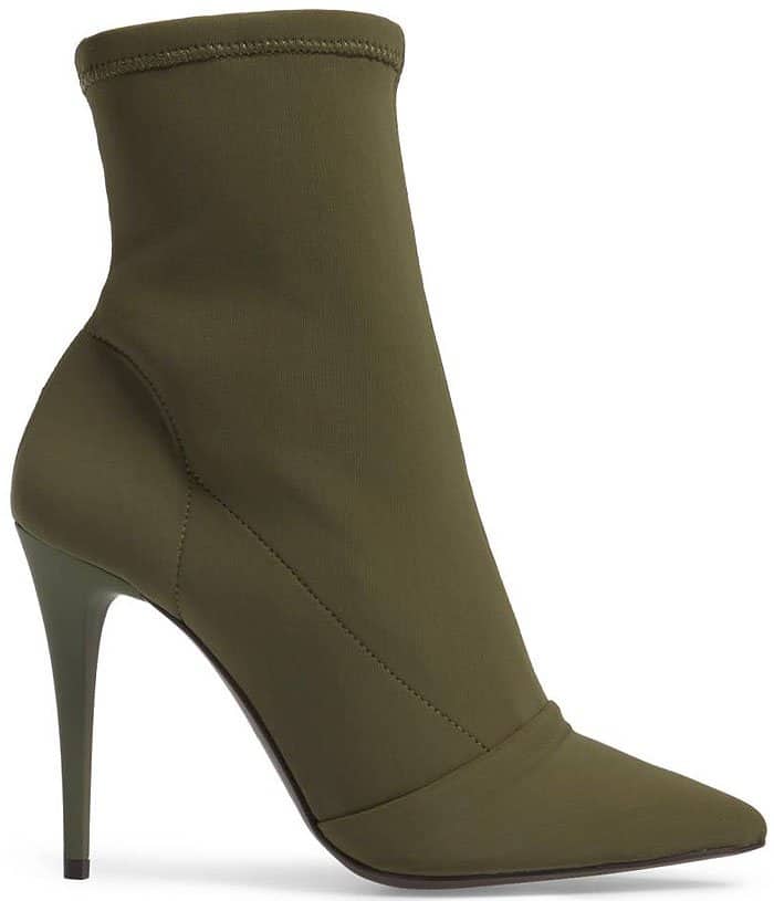 Dial up the drama in a pointy-toe boot balanced on a lofty stiletto heel and topped with a stretch shaft for a sock-like fit