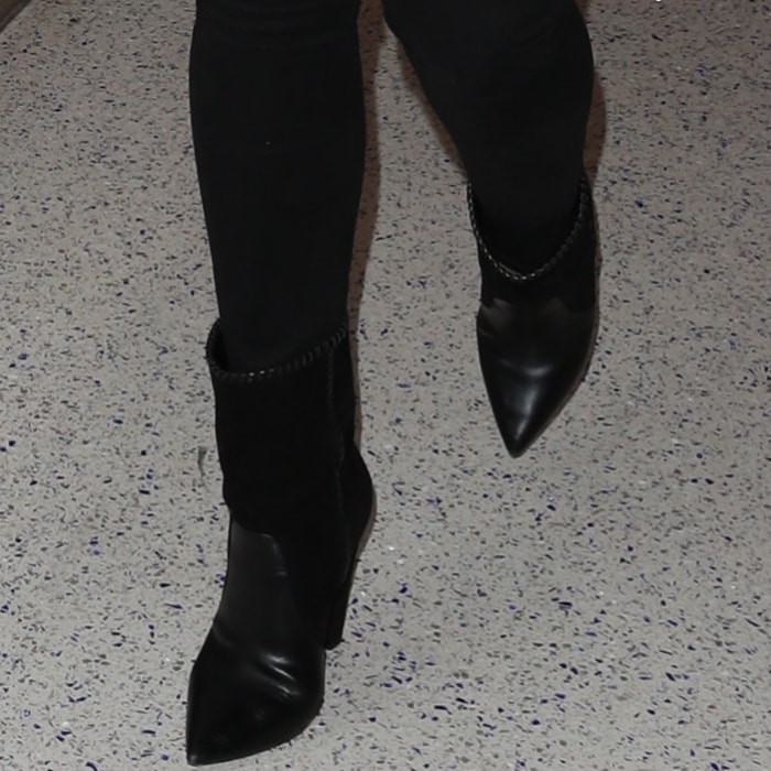 Chrissy Teigen Sashays Through LAX in Yeezy Season 5 Boots