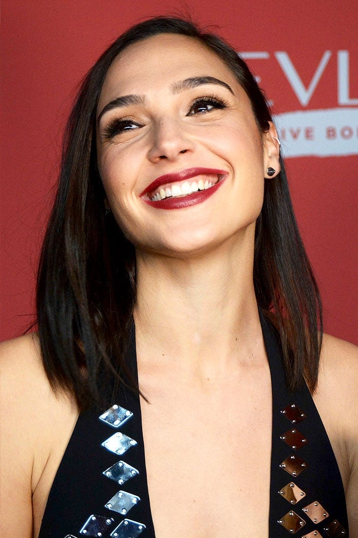 Gal Gadot sported striking berry lips and flashed her beautiful smile