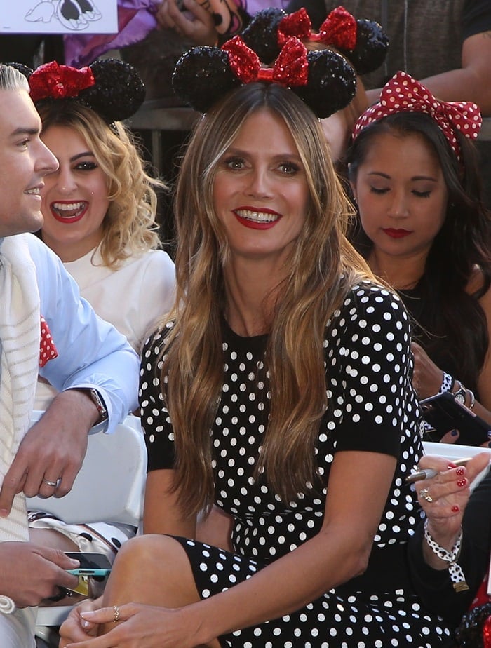 Heidi Klum in a polka-dot knit sweater and a matching sequin-dotted pencil skirt