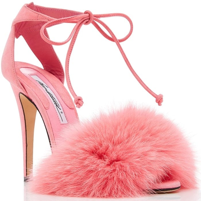 This sandal is rendered in pink kid suede and features a fur embellishment and strap detail