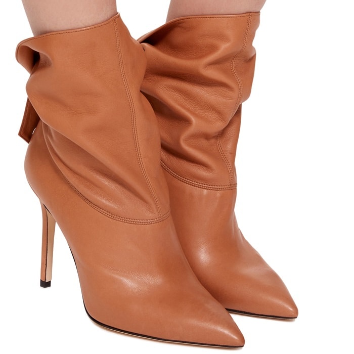 This bootie is rendered in nappa leather and features a stiletto heel and strap detail