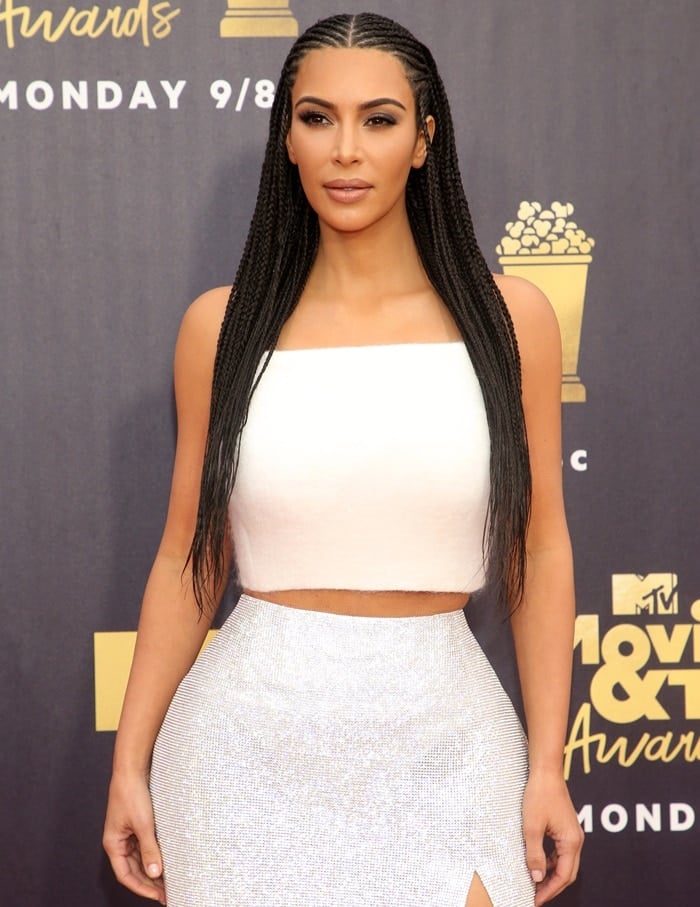 Kim Kardashian in a white mohair halter top paired with a crystal mesh column skirt from Atelier Versace
