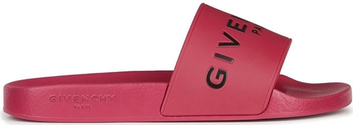 A bold Givenchy logo stamp crosses the wide strap of a cushy, water-friendly rubber slide sandal