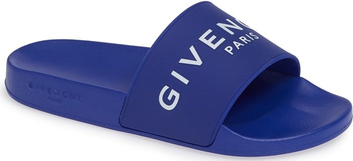 A bold Givenchy logo stamp crosses the wide strap of a cushy, water-friendly rubber slide sandal