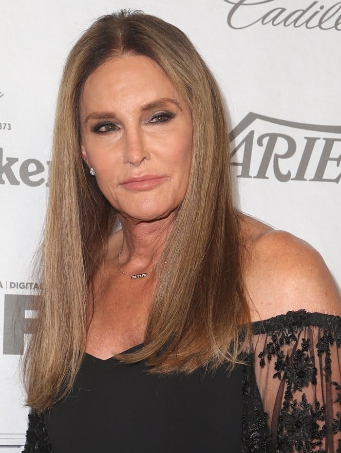 Caitlyn Jenner wearing her 'Caitlyn' necklace and a sexy black dress