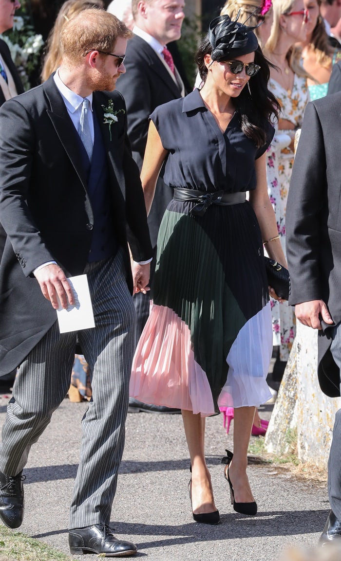 Duchess Meghan Markle arriving for the wedding of friends Charlie van Sraubenzee and Daisy Jenks at St. Mary the Virgin Church in Surrey, England, on August 4, 2018