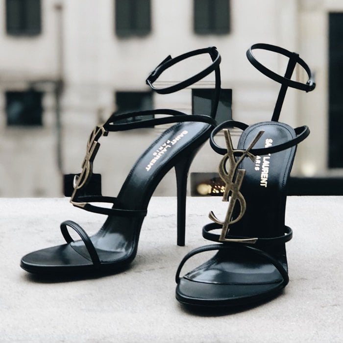 Saint Laurent's Cassandra sandals proudly display the label's YSL metallic monogram plaque