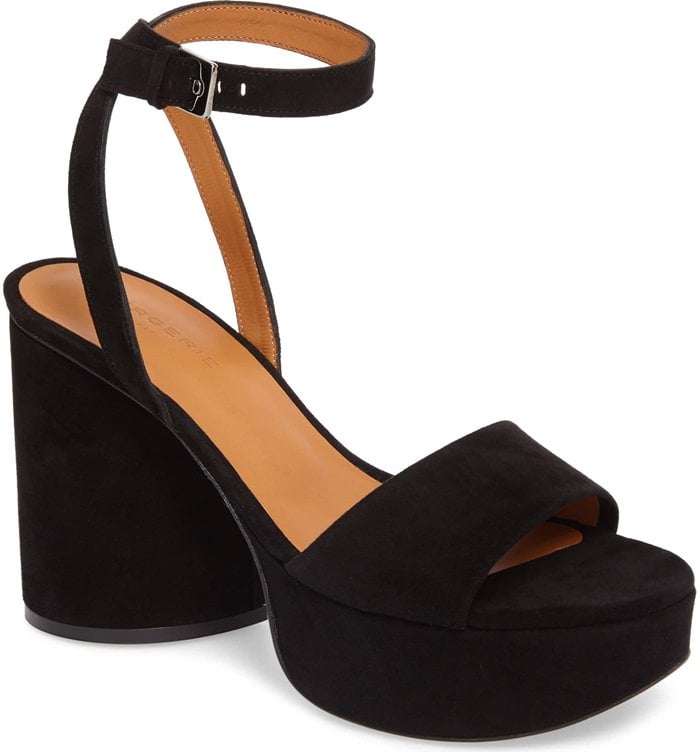 With its chunky heel and slender ankle strap, this bold platform sandal in jet-black suede is the perfect finish to party-season looks