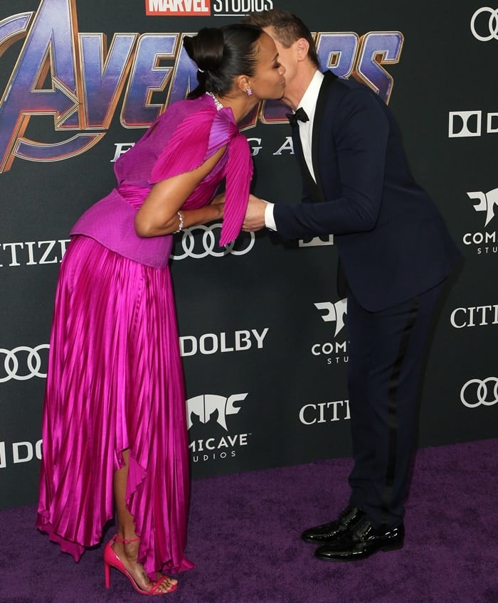 Zoe Saldana gets a kiss from Jeremy Renner at the Avengers: Endgame premiere