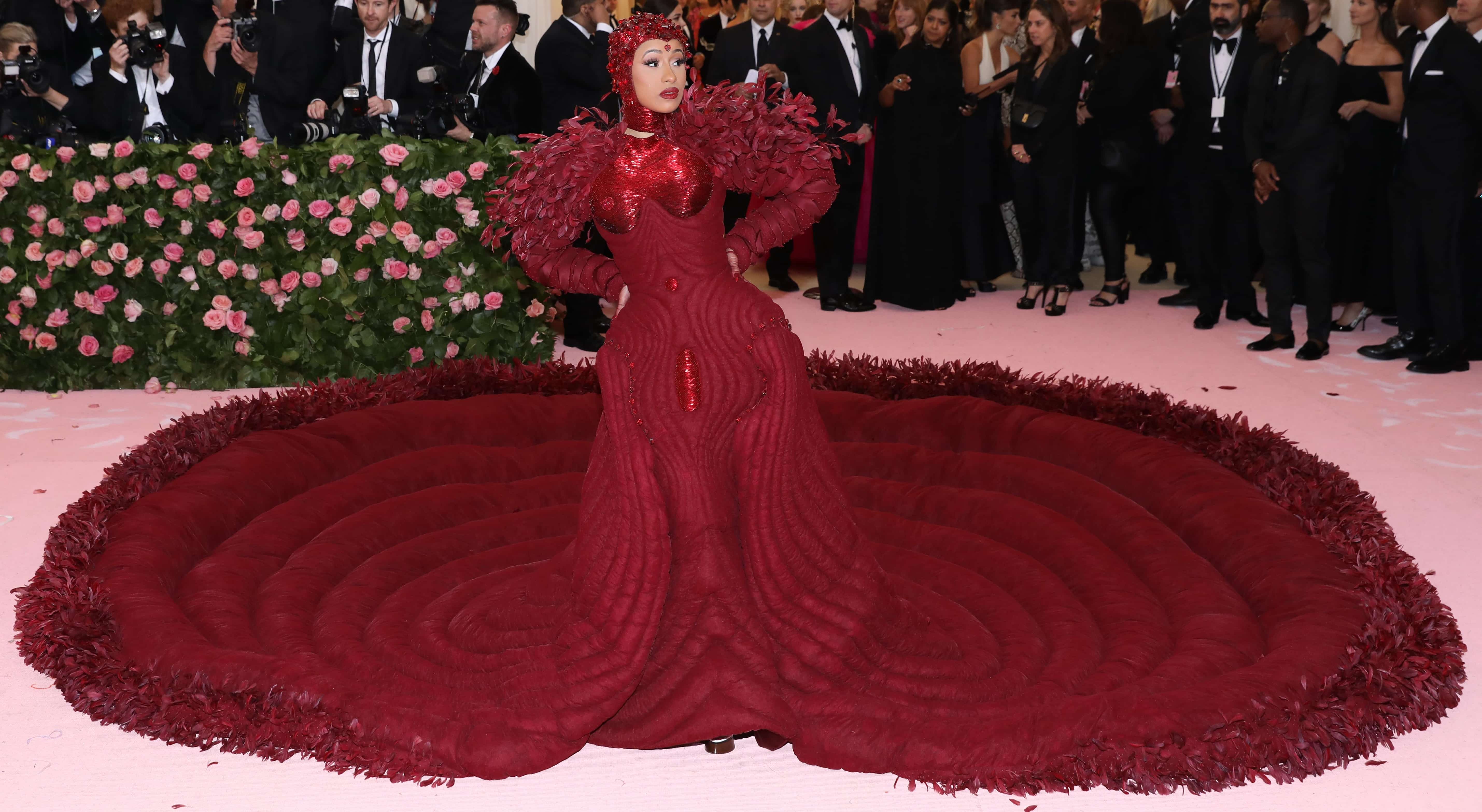 Cardi B's Thom Browne anatomical down-filled dress layered in oxblood tulle and silk organza