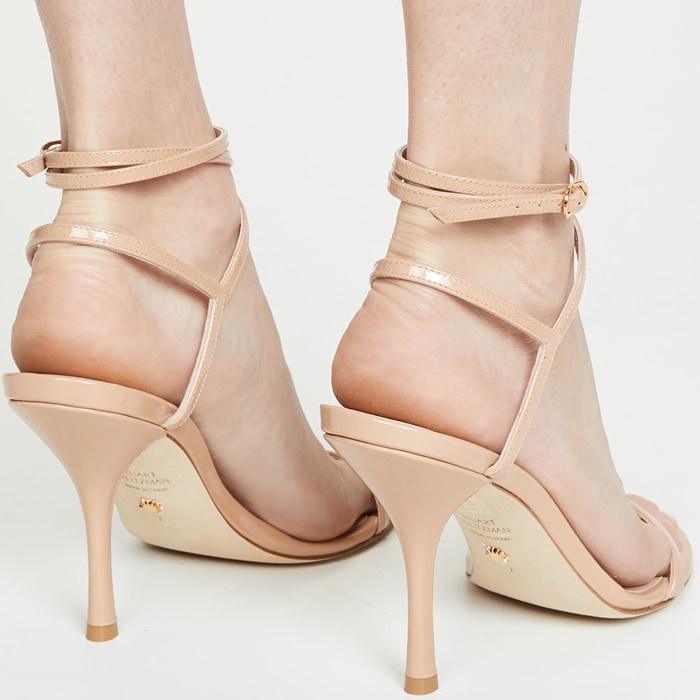 Stuart Weitzman's 'Merinda' sandals really will make your legs look longer thanks to their barely-there silhouette and 4-inch stiletto heel