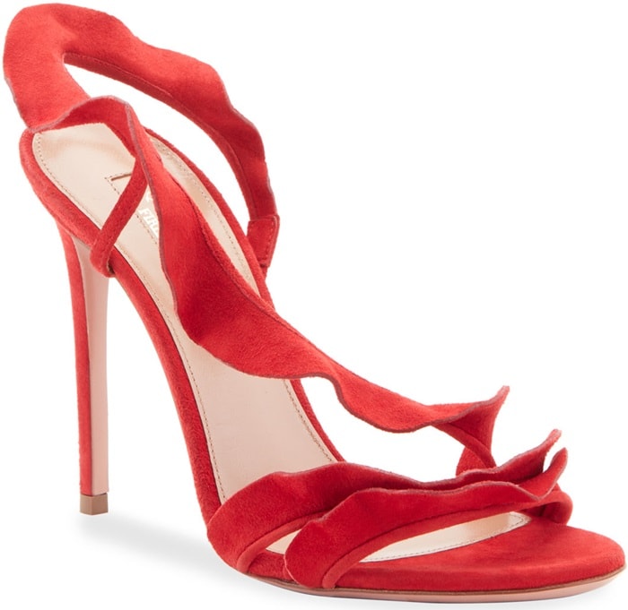 Made in Italy from buttery suede in vivid lipstick red, the strappy style features a flirty ruffle that cascades up the foot and wraps around the ankle