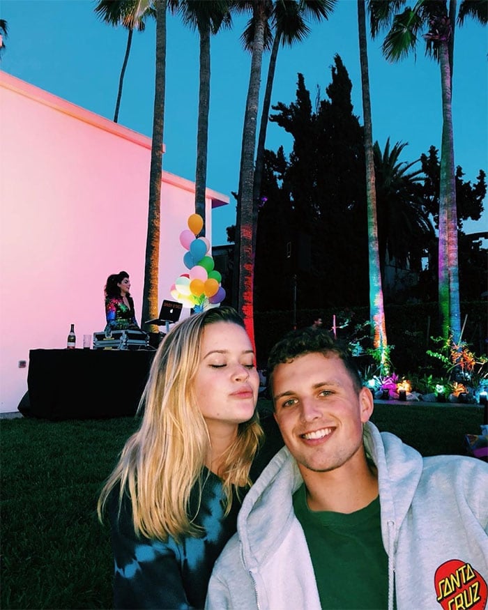 Ava Phillippe and her boyfriend, Owen Mahoney, enjoy a colorful evening under the palm trees at a Cinespia Hollywood Forever event