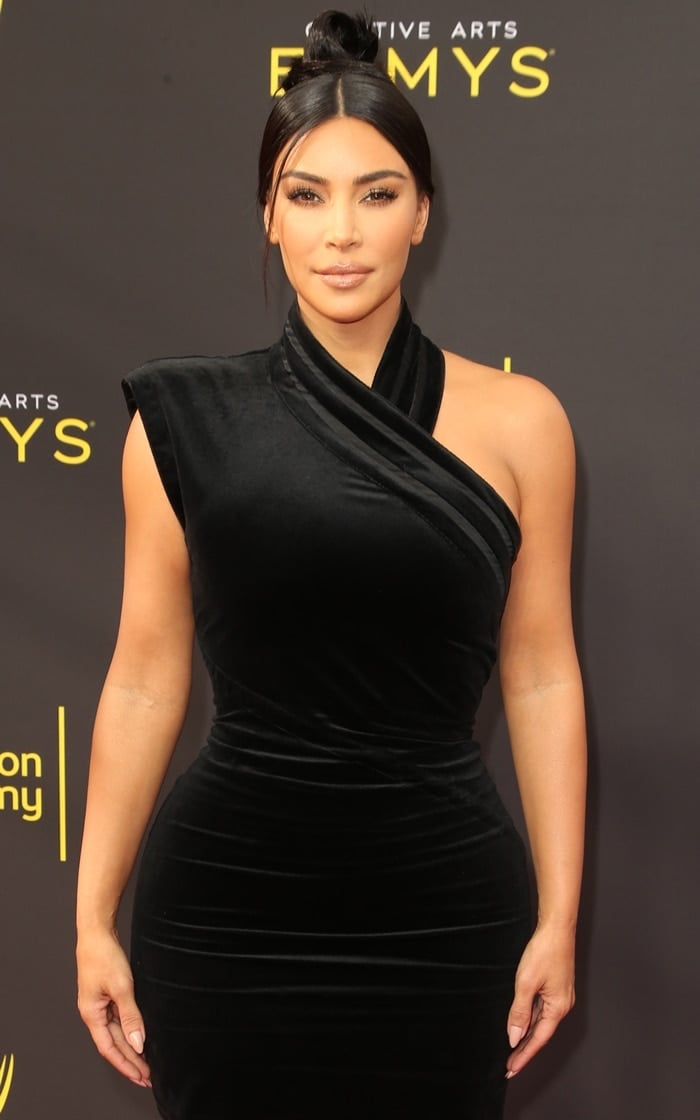 Kim Kardashian flaunted her curves in a sexy black dress